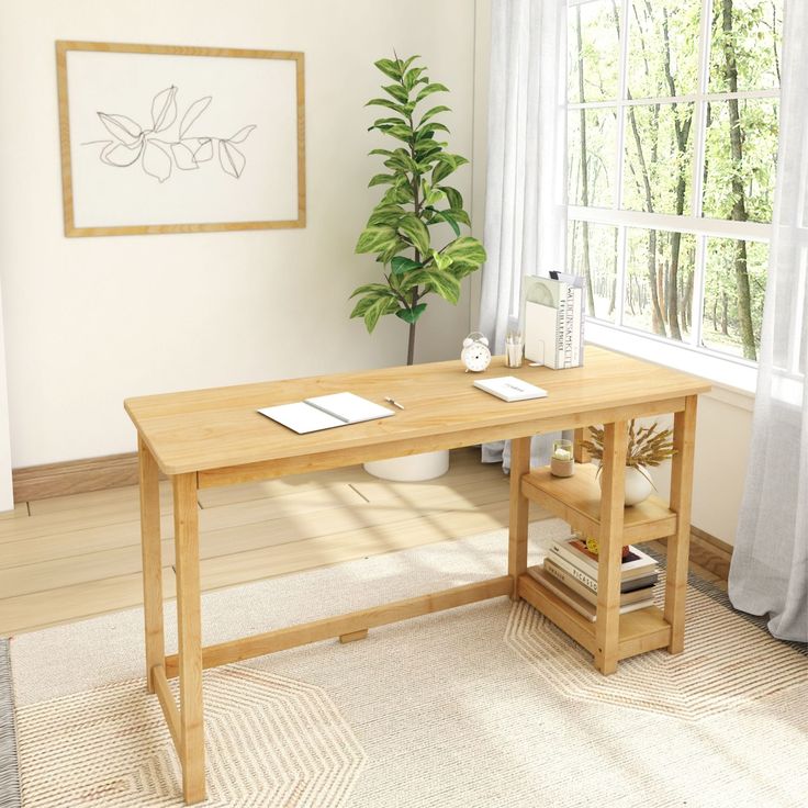 a wooden desk sitting in front of a window next to a potted green plant