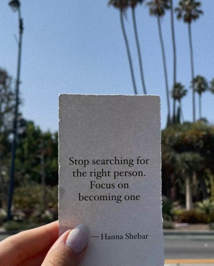 someone holding up a piece of paper with a quote on it that reads stop searching for the right person focus on becoming one