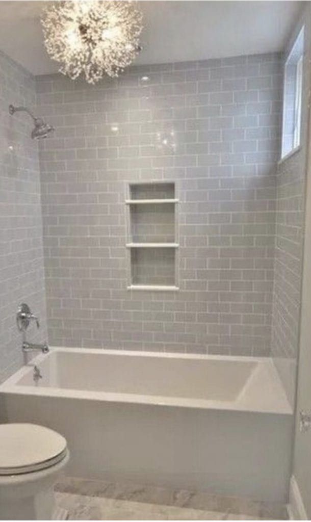 a bathroom with a toilet, tub and sink