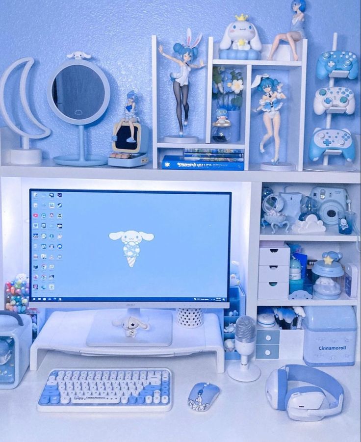 a desktop computer sitting on top of a desk next to a keyboard and mouse in front of a blue wall