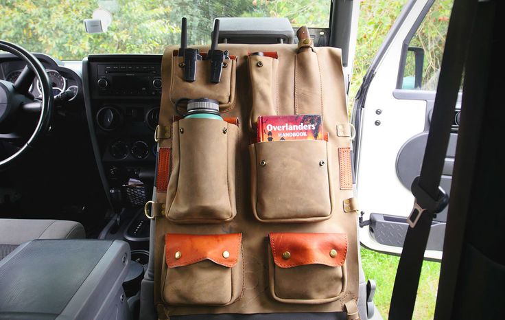 the interior of a vehicle with two bags on it