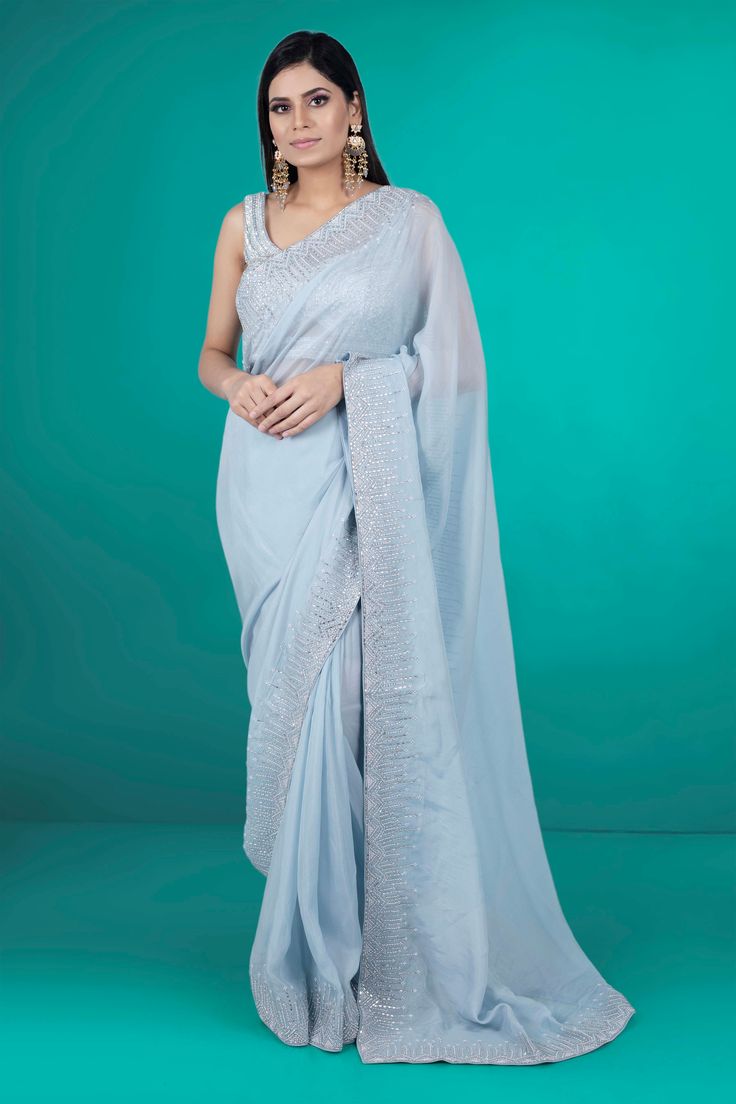 Get ready to rock any party with this stunning Party Wear Saree D-211. Featuring intricate stone work, this saree will surely make you stand out and be the center of attention. Don't settle for a basic saree, elevate your party look with this one-of-a-kind piece! Extra fabric inside the blouse Waist is stretchable Embellished Chanderi Saree For Navratri, Embellished Semi-stitched Chanderi Pre-draped Saree, Embellished Chanderi Saree In Traditional Drape, Embellished Chanderi Saree For Reception, Embellished Art Silk Saree For Navratri, Embellished Chanderi Saree For Eid, Navratri Embellished Art Silk Saree, Embellished Floor-length Chanderi Saree, Eid Party Wear Saree In Dola Silk