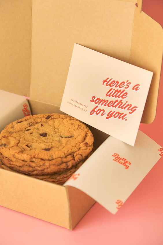 there's a chocolate chip cookie in a box with a note on it that says, here's a little something for you