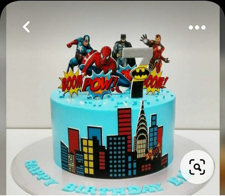 the birthday cake is decorated with superhero characters