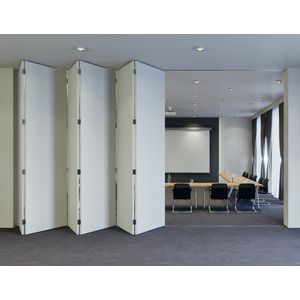 a room divider in an office setting with chairs and desks around the room