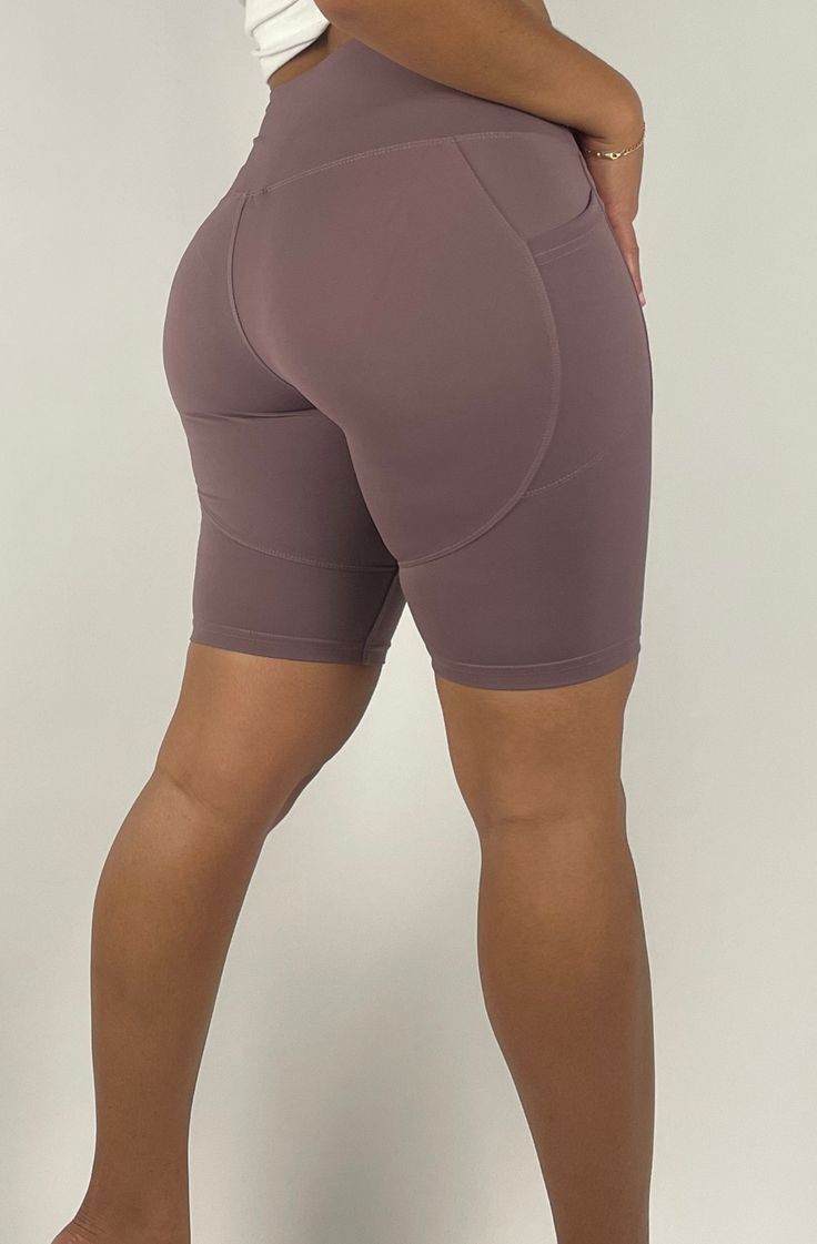 Designed for you to break a sweat, because we get it.Our Activewear shorts are great for cycling, hiking, or yoga and are made with a sweat-wicking fabric that's breathable, moisture resistant with a 4-way stretch. Featuring a flattering high-rise waistband, and two side pockets for your phone or wallet. Black runs Small, Size up from normal size Smoky Mauve runs true to size 78% Nylon / 22% Spandex Model wears a Small | Weighs 125 lbs | Height 5' 2" Versatile Gym Athletic Shorts, Versatile Solid Athletic Shorts For Gym, High Stretch Functional Athletic Shorts, Functional High Stretch Solid Athletic Shorts, Versatile Moisture-wicking Athletic Shorts For Gym, Functional Yoga Pants With Built-in Shorts For Sports, Versatile Activewear With Built-in Shorts For Running, Versatile Activewear With Built-in Shorts For Training, Versatile 4-way Stretch Athletic Shorts For Gym