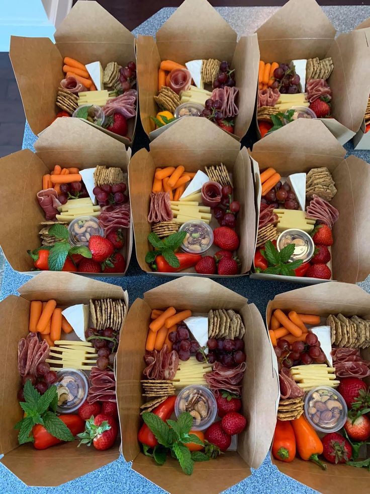 six boxes filled with assorted fruits and veggies on top of a table