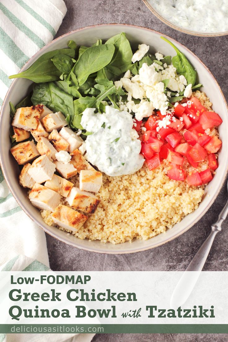 a bowl filled with chicken, rice and spinach