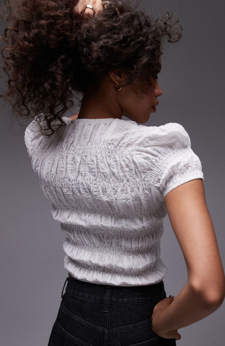 Head off to the weekend in textured finesse with this chic crop top made from breathable cotton. 20" length (size 8) Jewel neck Short sleeves 99% cotton, 1% elastane Machine wash, line dry Imported Spring Cropped Knit Top, Cropped Knit Top For Spring, Chic Fitted Textured Knit Blouse, Chic Textured Knit Fitted Blouse, Fitted Pointelle Knit Short Sleeve Top, Chic Cotton Tops With Crinkle Texture, Fitted Cropped Knit Top, Fitted Pointelle Knit Crew Neck Blouse, Chic Fitted Smocked Top With Short Sleeves