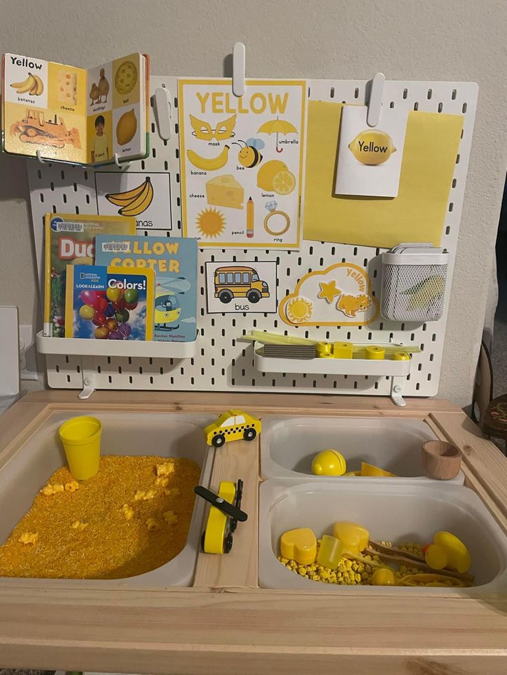 a wooden table topped with two trays filled with yellow food next to each other