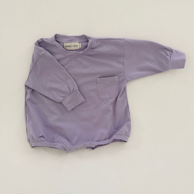 Harley Pocket Romper in Purple Cotton Bodysuit For Playtime, Solid Cotton Bodysuit For Playtime, Plain Cotton Bodysuit For Playtime, Cotton Long Sleeve Onesie For Fall, Cotton Bodysuit For Loungewear, Cotton Bubble Romper For Playtime, Long Sleeve Bodysuit For Playtime In Fall, Long Sleeve Bodysuit For Playtime, Spring Long Sleeve Bubble Romper For Playtime