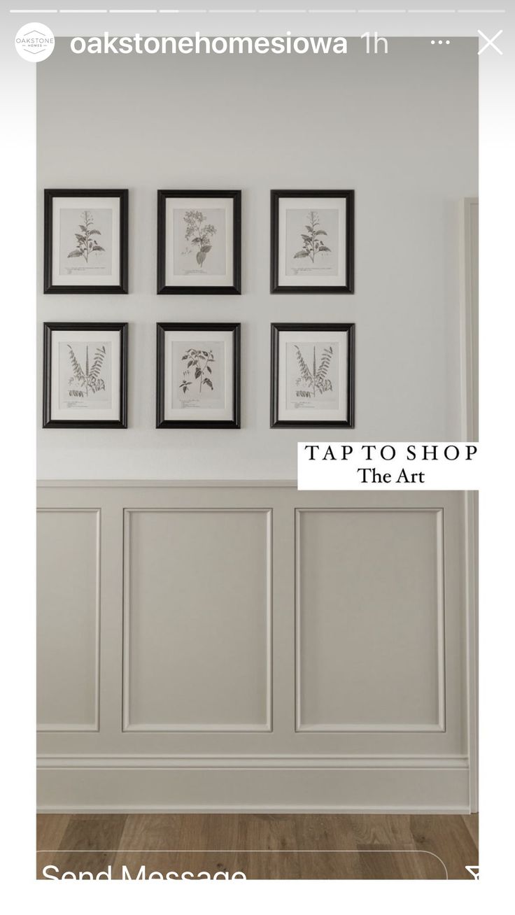 four framed pictures hang on the wall above a wooden floor in a room with white walls and wood floors