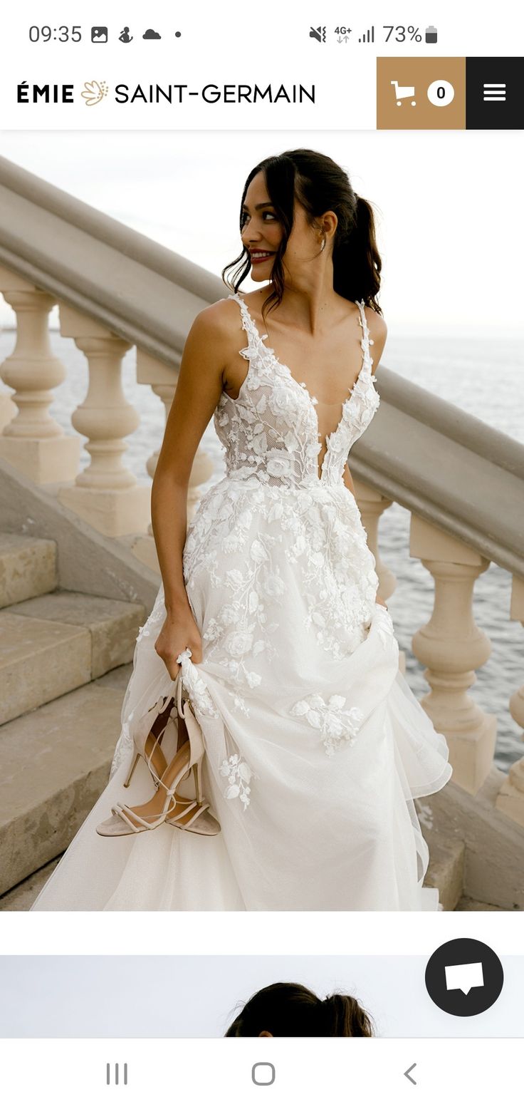 a woman in a wedding dress is walking down the stairs with her hand on her hip