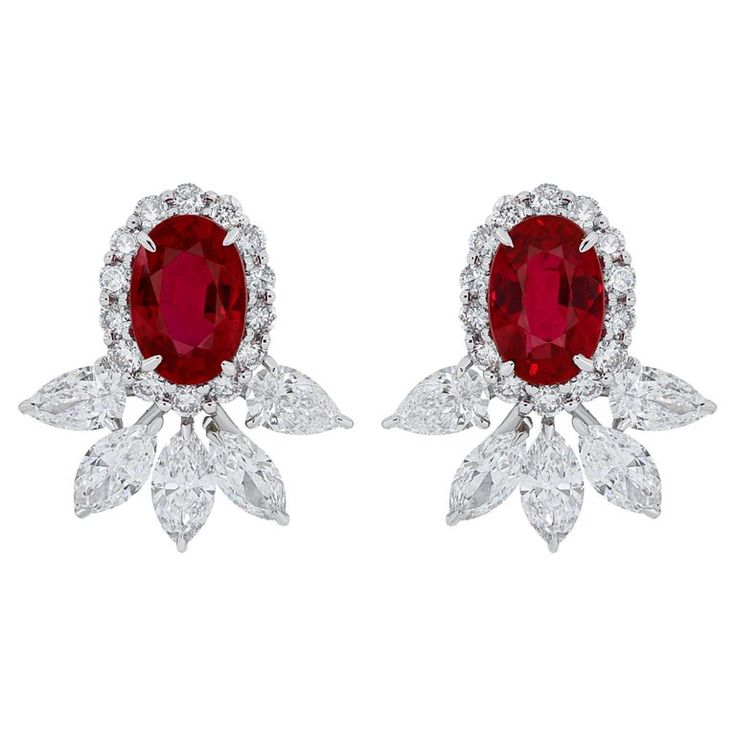 Elegant and exquisitely detailed 18 Karat White Gold Earrings, center set with 1.32Cts .Oval Shape vibrant Red Mozambique Ruby and micro pave set Diamonds, weighing approx. 1.14Cts Beautifully Hand crafted in 18 Karat White Gold. Stone Detail: Ruby Mozambique: 6x4MM Stone Weight: Ruby Mozambique: 1.32Cts Diamond: GH/SI Total Diamond Weight: 1.14Cts Oval Diamond Cluster Earrings For Formal Events, Gia Certified Oval Diamond Earrings, Elegant Red Oval Diamond Earrings, Oval Diamond Bridal Earrings With Brilliant Cut, Oval Red Jewelry With Pave Setting, Red Oval Jewelry With Pave Setting, Oval Diamond Accented Bridal Earrings, Oval Diamond Bridal Earrings With Diamond Accents, Oval Diamond Bridal Earrings With Accents