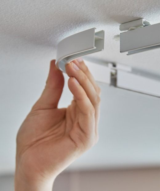 a person is holding their hand up to the ceiling