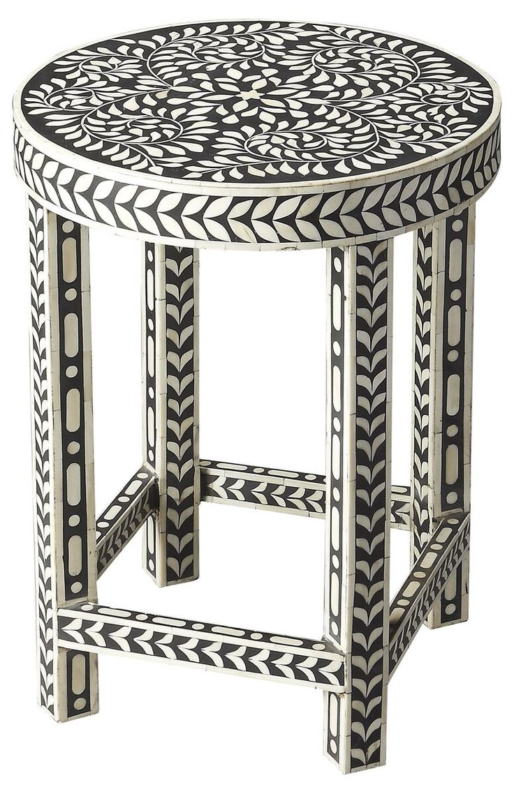 a black and white table with an intricate design on it