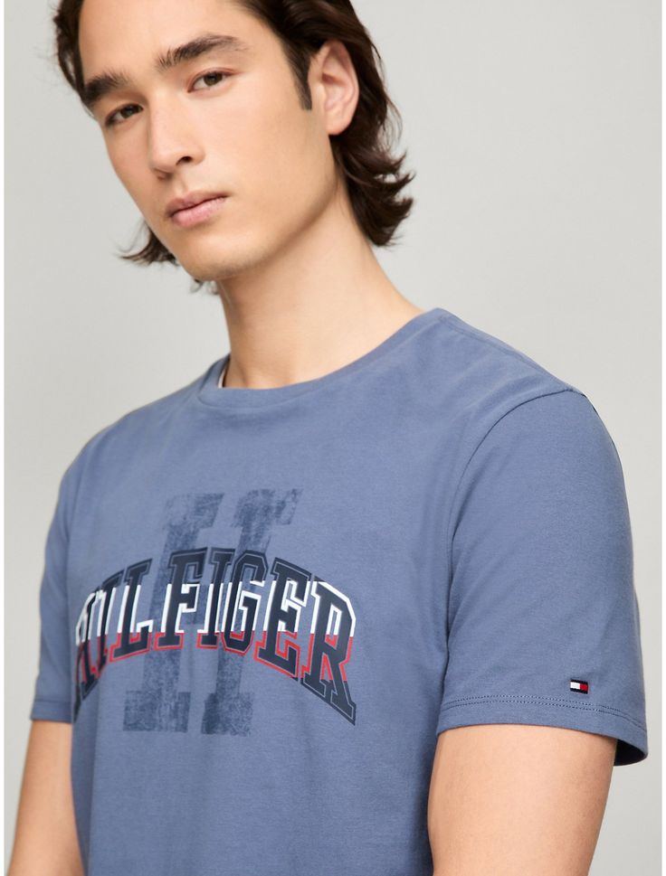 Tommy Hilfiger men's T-shirt. Made from lightweight cotton jersey, known for its breathability and stretch, our comfortable crewneck tee is cut in an easy fit and finished with our Hilfiger graphic.  Material: 100% Cotton. Tommy Hilfiger Graphic Tee For Summer, Tommy Hilfiger Graphic Tee With Crew Neck, Tommy Hilfiger Graphic Tee With Short Sleeves, Tommy Hilfiger Graphic Tee With Graphic Print, Sporty Tommy Hilfiger Tops With Graphic Print, Tommy Hilfiger Sporty T-shirt For Summer, Tommy Hilfiger Summer Graphic Tee, Tommy Hilfiger Graphic Tee For Streetwear, Tommy Hilfiger Short Sleeve Graphic Tee