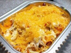 a casserole dish with meat and cheese in it