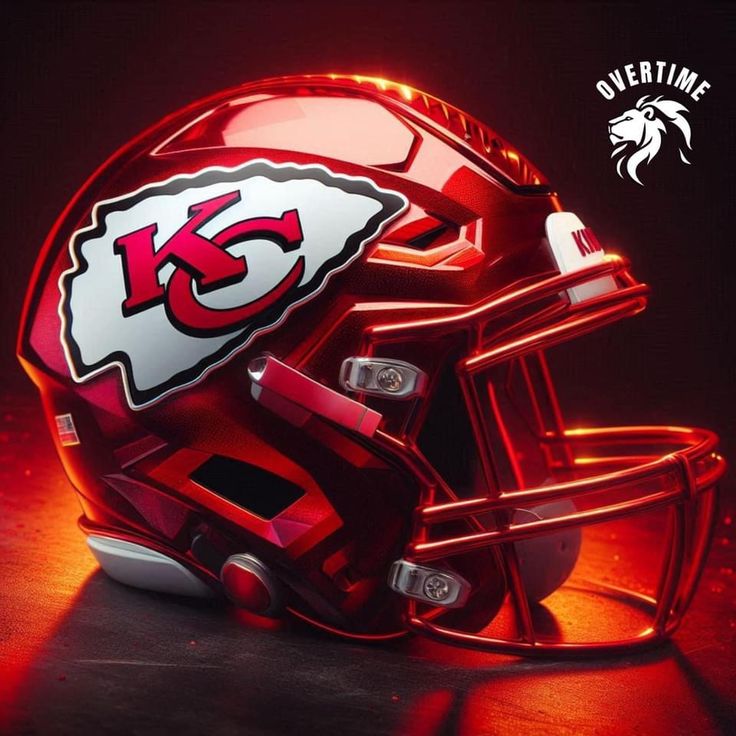 a helmet with the kansas chiefs logo on it is lit up in red and white