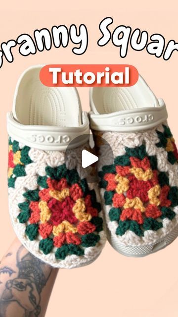 someone is holding up their crocheted slippers to show how they are made