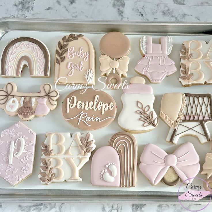 a tray filled with lots of decorated cookies