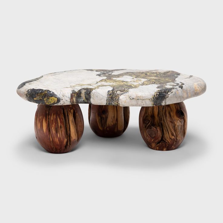 three wooden stools sitting on top of each other