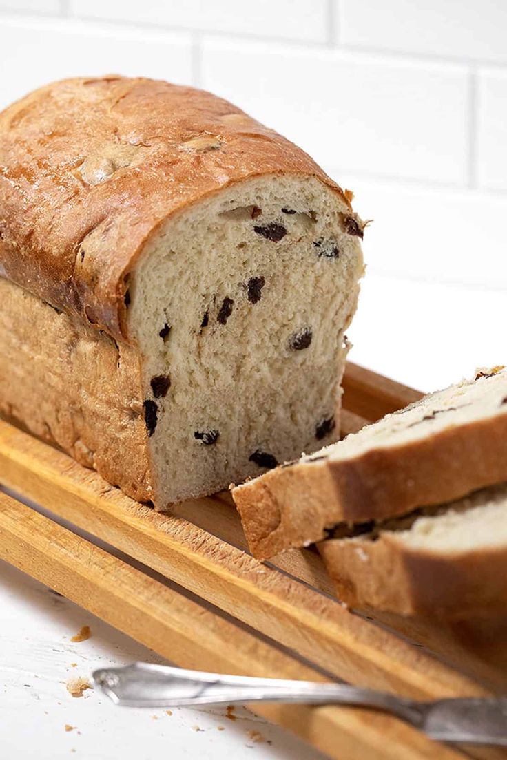 a loaf of bread sitting on top of a cutting board