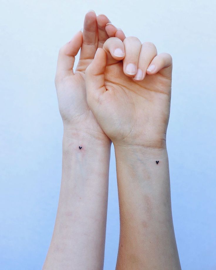 Best-Friend Tattoos |  couple finger print tattoo ideas Tattoo Idea For Twins, Minimalist Twin Tattoo, Simple Twin Tattoos, Minimalistic Sibling Tattoos, Sister Sign Tattoo, Small Tattoos For Twins, Tattoo Twins Sister, Fraternal Twin Tattoos, Matching Twin Sister Tattoos