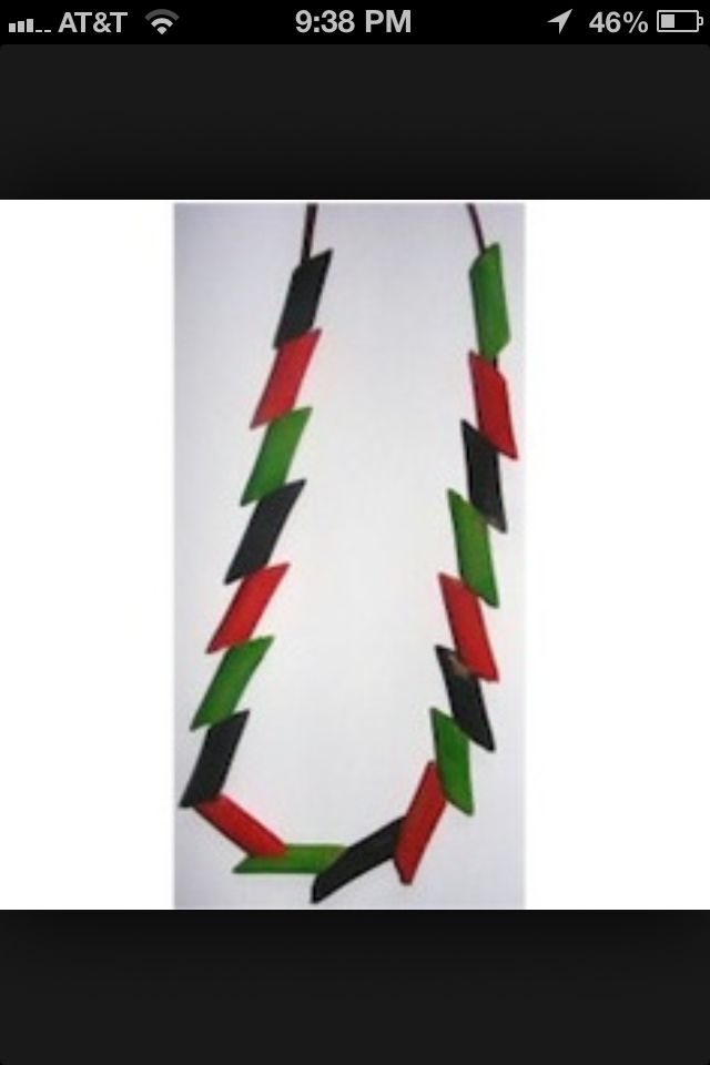 a necklace made out of red, green and black strips