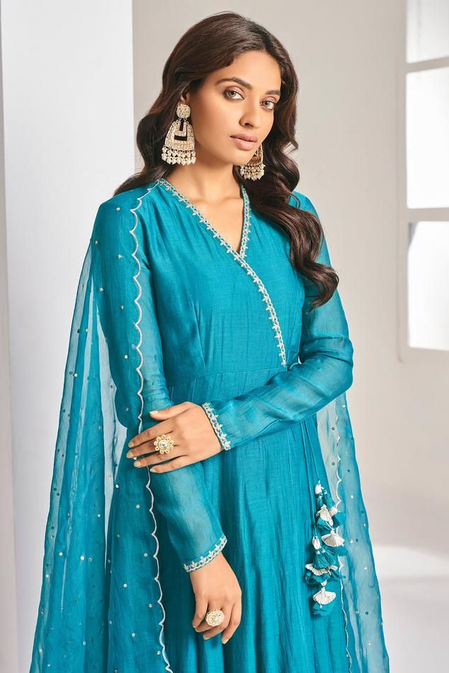 Olympic blue soft chanderi angrakha anarkali with aari, pita and mukaish embroidered neckline. Comes with pant and a dupatta.
Components: 3
Pattern: Embroidered
Type Of Work: Aari, Pita, Mukaish
Neckline: V Neck
Sleeve Type: Full
Fabric: Anarkali: Soft chanderi, Pant: Cotton stretch, Lining: Chanderi
Color: Blue
Other Details: 
Attached lining
Length:
Anarkali: 52 inches
Sleeves: 23 inches
Pant: 38 inches
Dupatta: 2.5 mtrs
Occasion: Mehendi and Haldi - Aza Fashions Angrakha Anarkali, Blue Anarkali, Types Of Work, Embroidered Neckline, Blue Soft, Set For Women, Pita, Anarkali, Aza Fashion