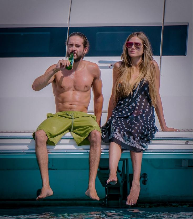 a man and woman are sitting on a boat