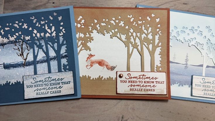 three handmade cards with trees and animals on them