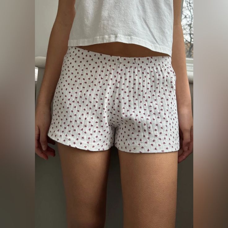 Soft Cotton Sweatshorts With An Elastic Waistband And Floral Pattern. Fabrics: 96% Cotton, 4% Elastane Measurement: 10" (25cm) Rise, 2.5" (6cm) Inseam, 28" (71cm)Waist (Stretches) Made In: Italy Summer Mini Length Loungewear Shorts, Cotton Mini Shorts For Day Out, Casual Mini Shorts For Loungewear, Vacation Shorts With Elastic Waistband And Mini Length, Vacation Mini Shorts With Elastic Waistband, Daywear Pajama Shorts, Mini Length Shorts With Elastic Waistband For Vacation, Vacation Mini Length Shorts With Elastic Waistband, Casual Mini Shorts With Elastic Waistband