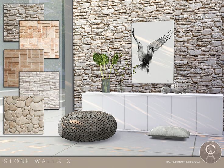 a stone wall is next to a white cabinet with a vase and plant in it