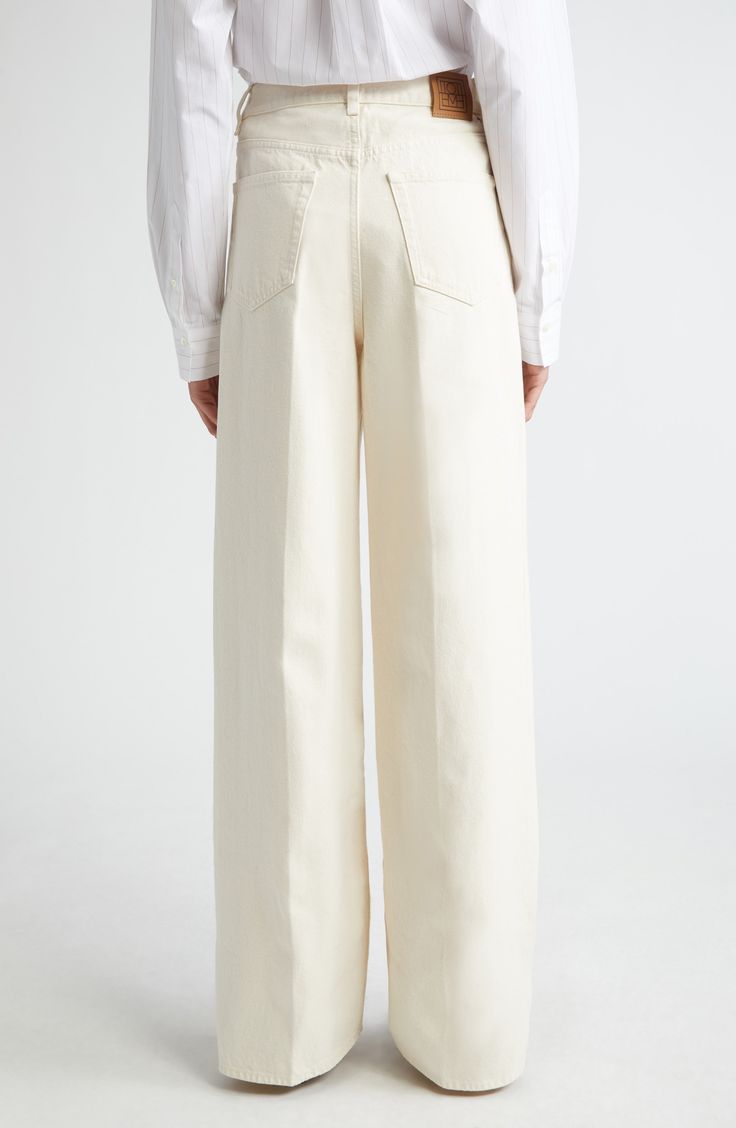 Pressed creases add definition to the wide-cut legs on these high-waisted pants cut from a midweight organic-cotton denim. Zip fly with button closure Five-pocket style 100% organic cotton Machine wash, line dry Made in Italy Designer Clothing Beige Wide Leg Flare Jeans For Work, Beige Wide Leg Pants With Five Pockets, Wide Leg Flare Jeans In Beige With Five Pockets, Beige Wide-leg Jeans With Five Pockets, Beige Wide-leg Jeans, Beige Wide Leg Cargo Jeans, Beige Wide-leg Cotton Jeans, Spring Cream Cotton Flare Jeans, Beige Wide-leg Pants With Five Pockets