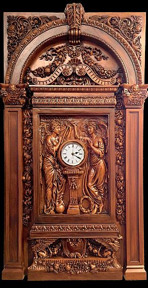 an ornate wooden clock with carvings on the front and sides, depicting people holding hands