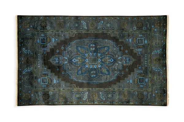 an antique rug with blue and brown colors on the bottom, surrounded by ornate designs