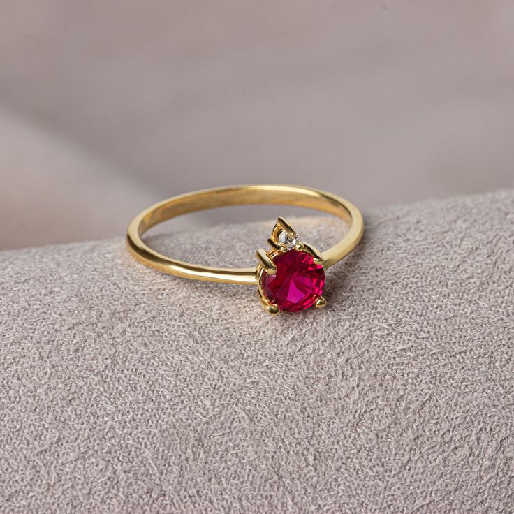 Ruby stone throws negative energy out of the human body and creates a firewall against bad energy coming from outside.It gives the strength to overcome difficulties easily. Ruby is the birthstone for those born in July. Meet the essence of elegance: Solitaire ruby ring. Handcrafted with precision, this exquisite piece features a majestic sapphire set in a magnificent design. A symbol of timeless beauty, it embodies sophistication and elegance. Elevate your style with this breathtaking masterpiec Elegant Ruby Ring With Center Stone For Promise, Elegant Brilliant Cut Ruby Ring Gift, Elegant Brilliant Cut Ruby Ring, 14k Gold Solitaire Diamond Ring For Valentine's Day, Elegant Jewelry With Lab-created Ruby For Promise, Elegant 14k Gold Birthstone Ring For Promise, Elegant Lab-created Ruby Jewelry For Promise, Elegant Lab-created Ruby Birthstone Ring With Center Stone, Valentine's Day 14k Gold Solitaire Diamond Ring