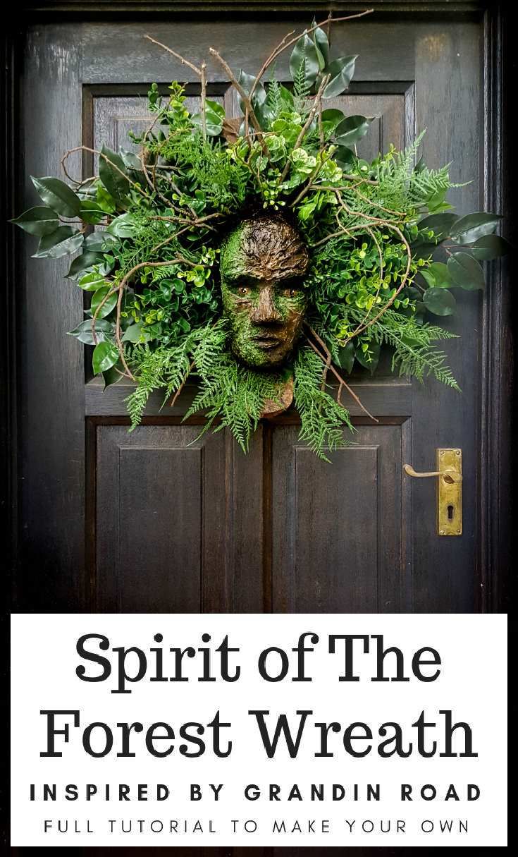 a door with a wreath on it that says spirit of the forest wreath