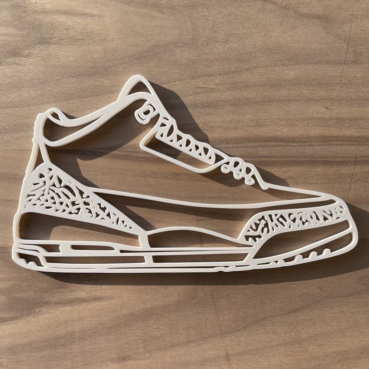 This Jordan Air 3 inspired silhouette of the iconic shoe is a must have for every sneaker head. A Perfect gift for everybody that loves and collects sneakers. 3D printed with bio degradable PLA. Available in a rainbow of colors. Size is approximately 10 in x 5.5 in (25.5cm x 15cm) Listing is for one sneaker wall art piece, actual shoes not included. Colors may vary due to monitor settings. Air Jordan Nike Mural, Nike Air Force 1 Cake Template, Nike Shoe Wall Print, Nike Shoe Template Printable Pattern, Shoe Template Printable Nike, Floating Shoe Shelves Jordans, Shoe Art Wall, Nike Air Svg File Free, Custom Nike Sign