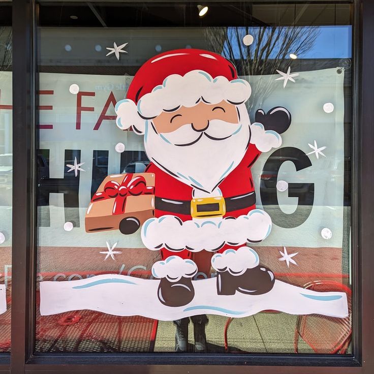 a santa clause is in the window of a store