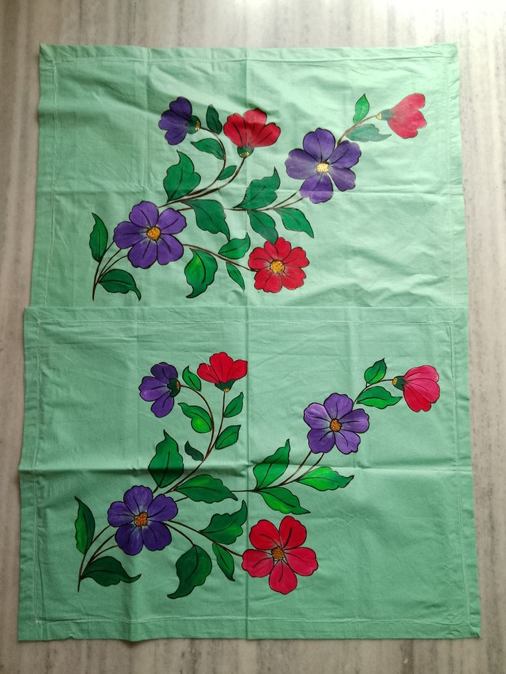 a piece of cloth with flowers painted on it