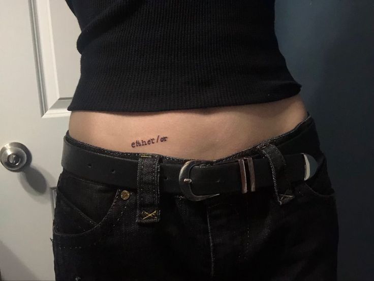 a person with a tattoo on their stomach