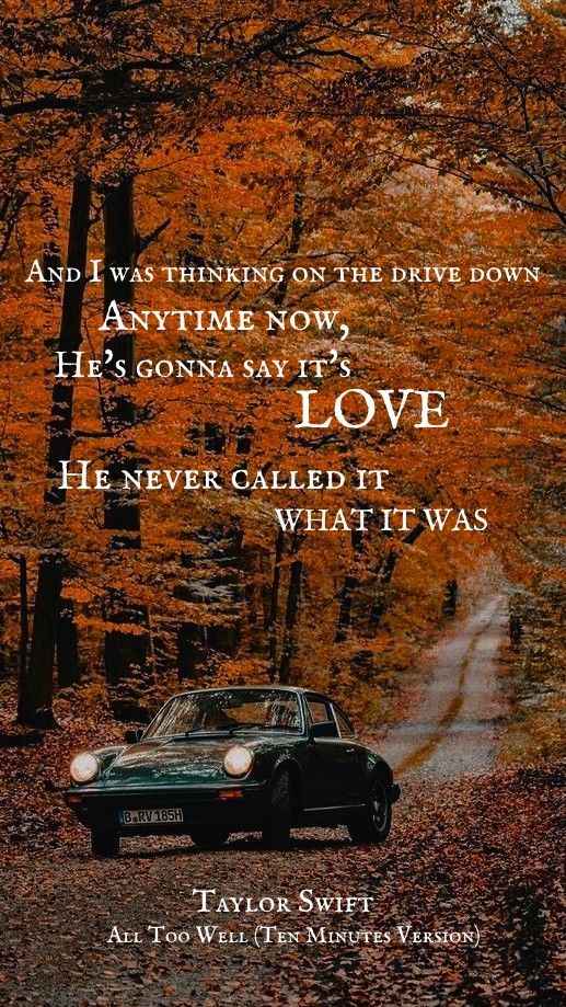 a car driving down a road surrounded by trees with leaves on the ground and an inspirational quote from taylor swift