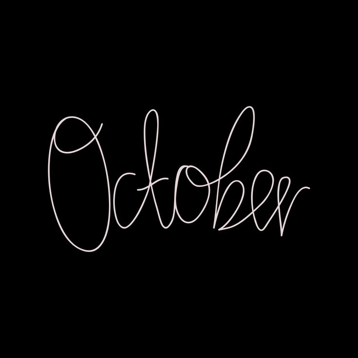 the word october written in cursive writing on a black background with white ink