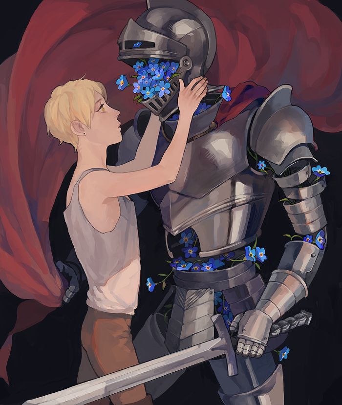 a young boy is touching a knight's face with flowers in front of him