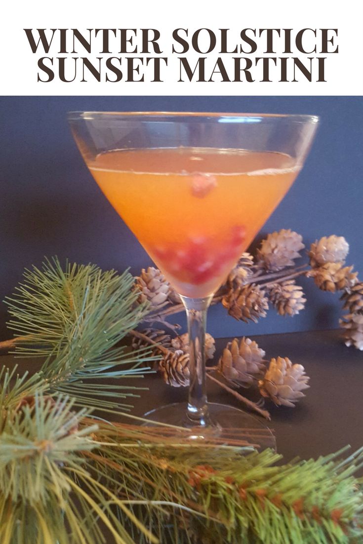 a drink in a glass with pine cones on the rim and text overlay reads winter solstice sunset martini