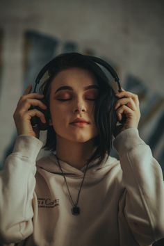 a woman wearing headphones listening to music