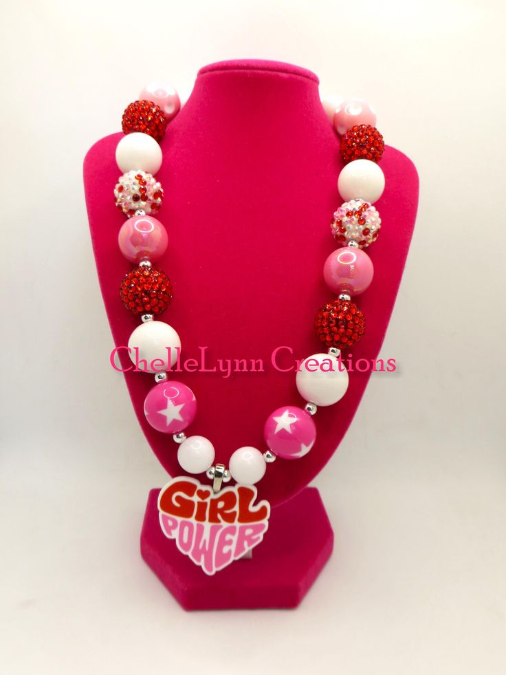 -  Girl Power bubblegum bead necklace with pink and white beads and silver spacers. So cute. -  Your little girl or toddler will look like a Princess in this beautiful, fun, Chunky Bubblegum Necklace. -  This necklace would be the perfect dazzling addition for your little Princess outfit to wear for any special occasion. -  Necklace length 17"  20mm beads & 14mm beads Materials:  acrylic beads, resin beads, bead wire, crimp tubes, jump rings, stainless steel clasps **Custom Orders Are Welcome** Ready to ship in 1 to 3 business days by USPS First Class Mail. - Returns & Exchanges I do accept returns and exchanges.  Just mail it back to me within 7 days of delivery. WARNING The jewelry is made with small beads and small parts.   Please do not leave your child unattended while wearing the jew Playful White Beaded Necklaces For Birthday, Playful White Beaded Necklace For Birthday, Fun Pink Beaded Necklaces With Letter Beads, Pink Letter Beads Fun Necklaces, Cute White Necklace With Heart Beads, Playful Pink Beaded Necklaces For Birthdays, Playful Pink Beaded Necklaces For Birthday, Playful Pink Beaded Necklace For Birthday, Pink Beaded Necklace For Valentine's Day