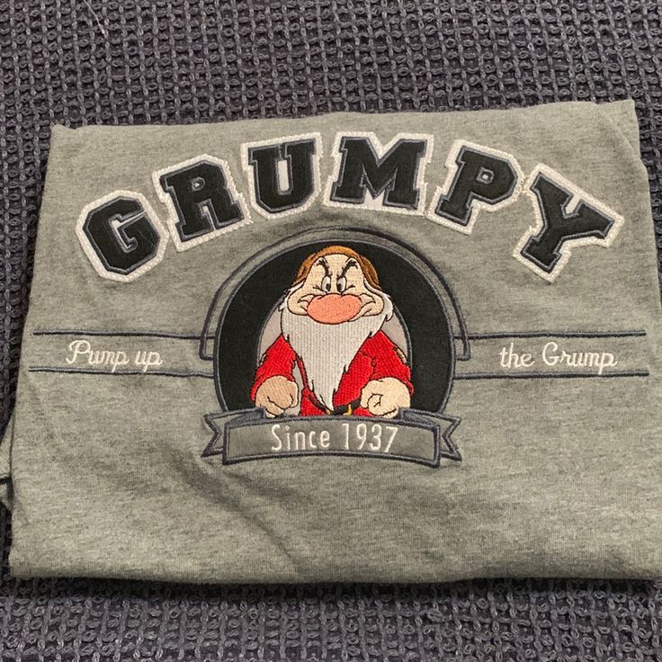 Brand New Walt Disney World Grumpy T-Shirt Disney Cotton Tops With Embroidered Graphics, College Shirt Design, Snow White Grumpy, Marvel Comic Book Characters, College Shirt, Mickey Mouse T Shirt, Mickey Mouse Shirts, College Shirts, Vintage Disneyland